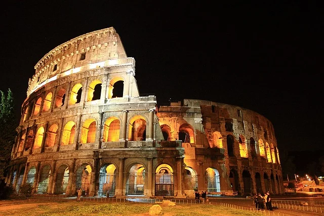 An image of The Colosseum during the night time which is also a Historical Sites in Rome